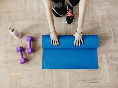 Top view of an exercise mat and a stopwatch